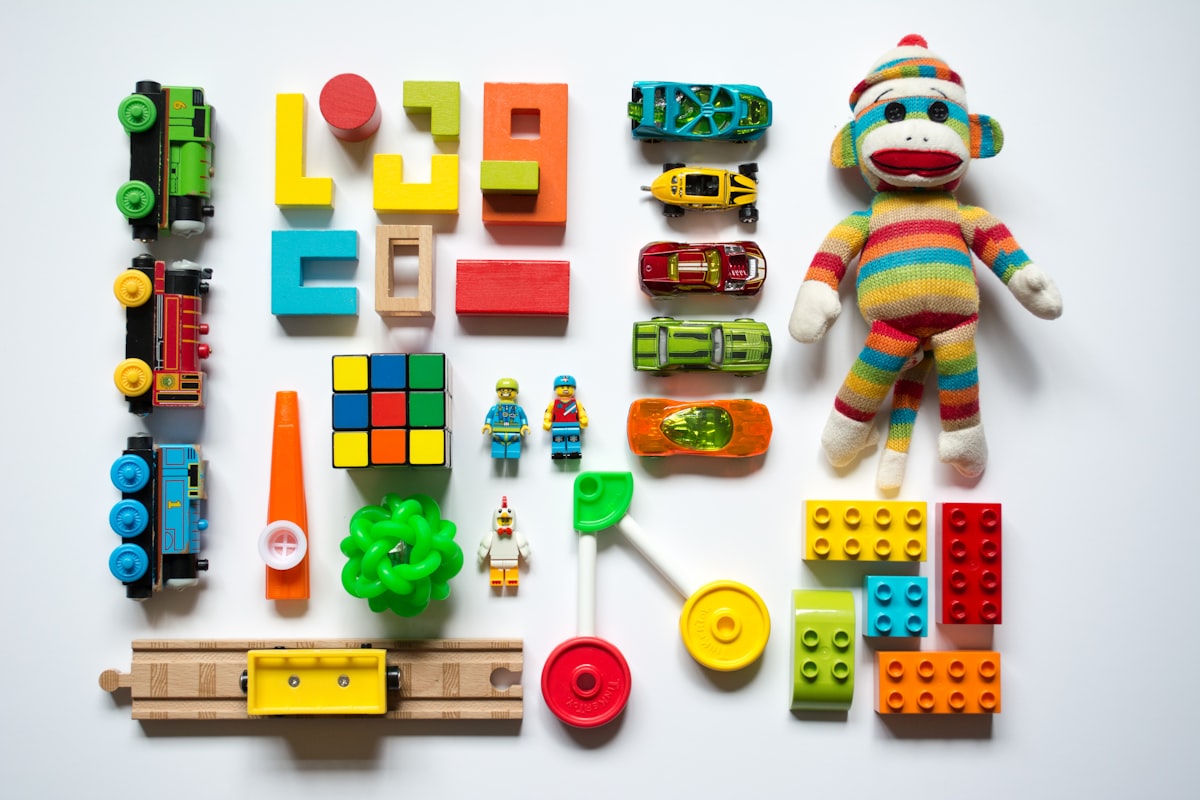 A collection of wooden trains, blocks and classic toys